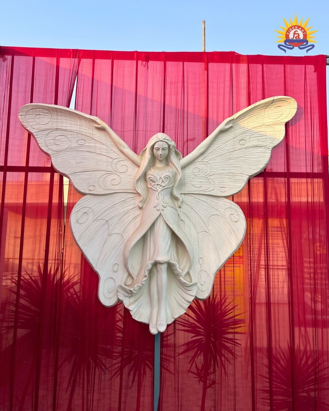 Fairy with wings relief sculpture on a wedding backdrop