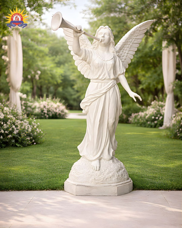 White angel statue blowing a trumpet in a garden